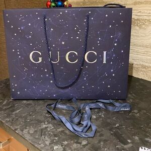 Gucci gift bag with matching gucci ribbon